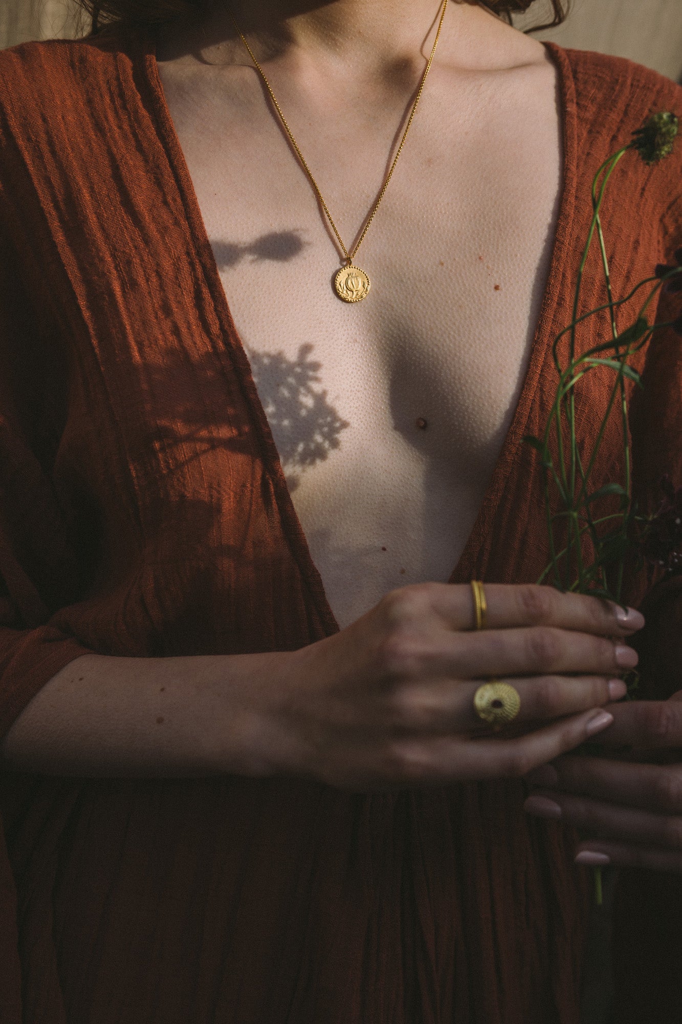 Model wearing the Moznabi Anar Gold Pendant