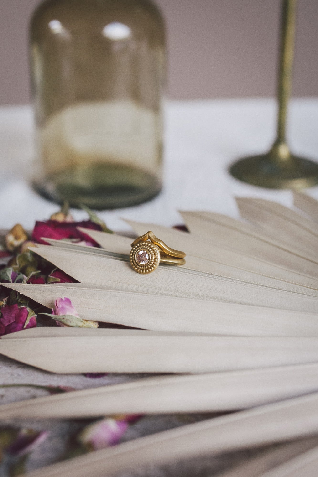 The Aroosi Champagne Diamond Ring paired with a gold fitted wedding band