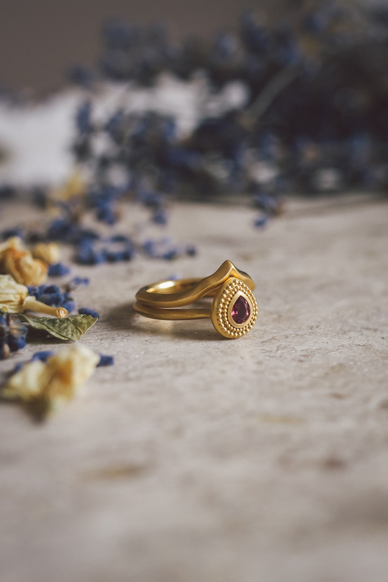 Aroosi Ruby & Garnet Ring stacked with handmade gold wedding band