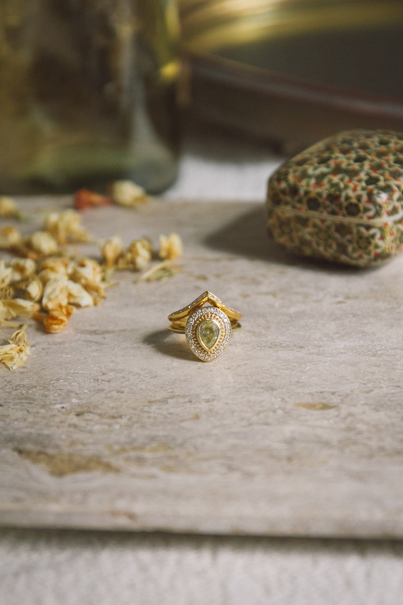 Aroosi Yellow Pear Diamond Halo Ring paired with Moznabi Wedding Band