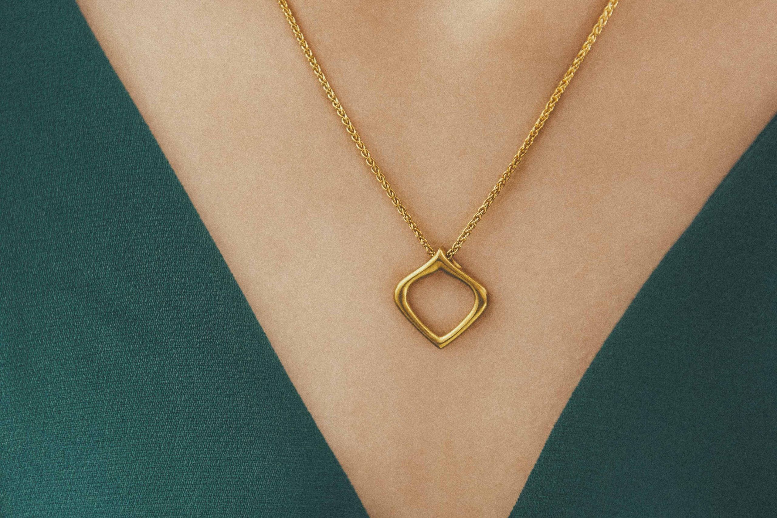 Closeup of handmade Essence of Persia Gold Pendant