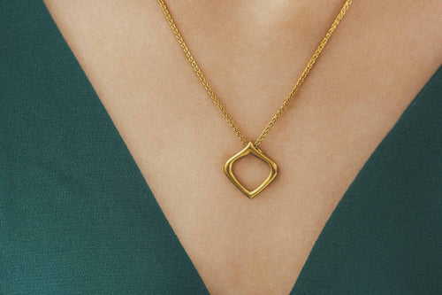 Closeup of handmade Essence of Persia Gold Pendant