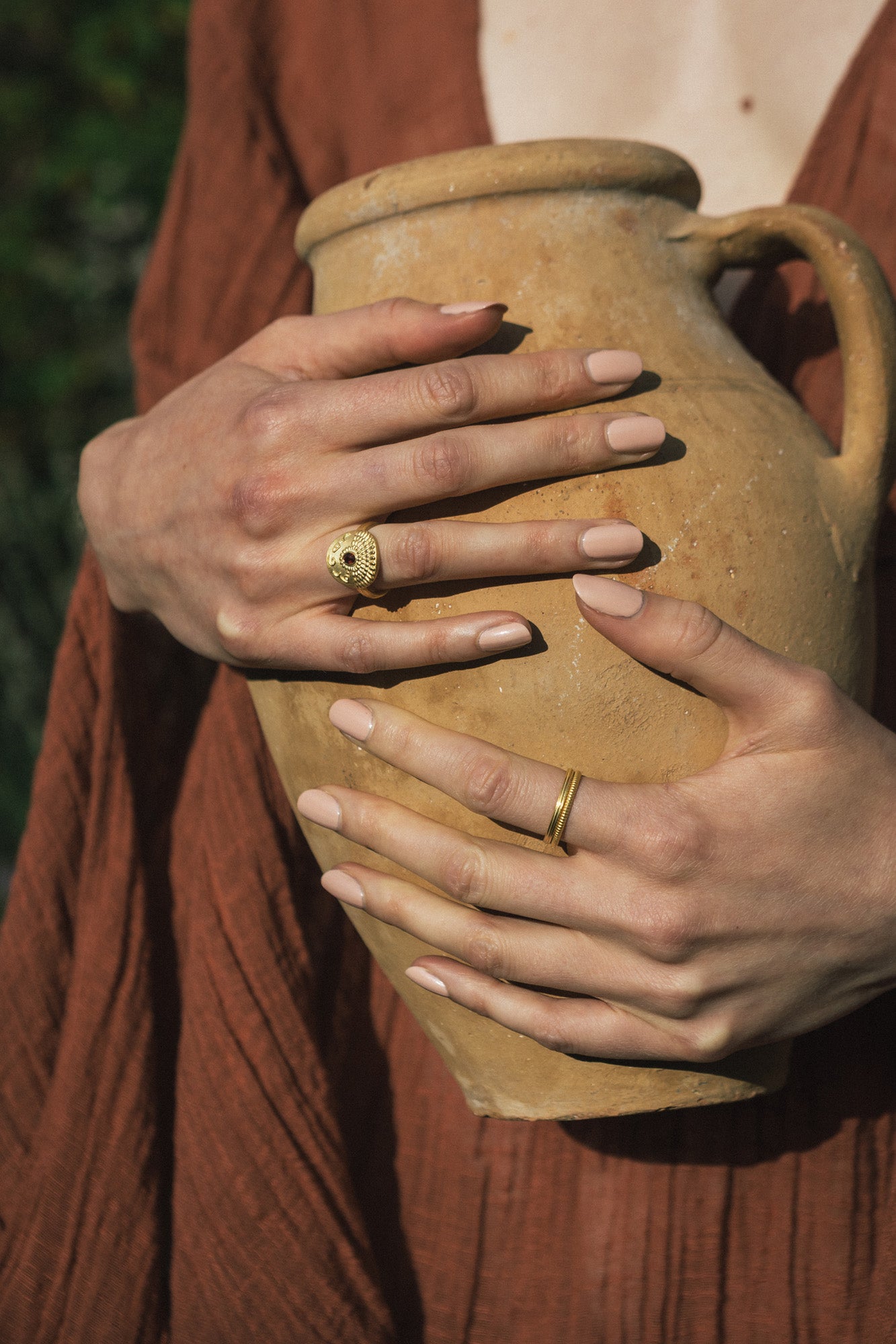 Rings from the Faravahar collection shown on a model