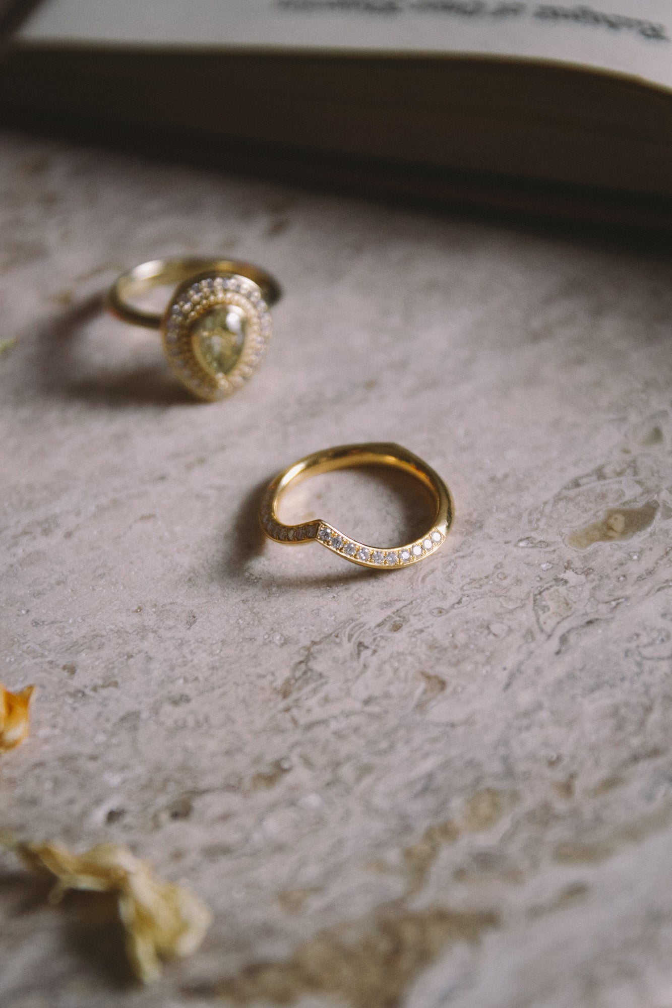 Fitted wedding band paired with Aroosi Yellow Pear Diamond Halo Ring