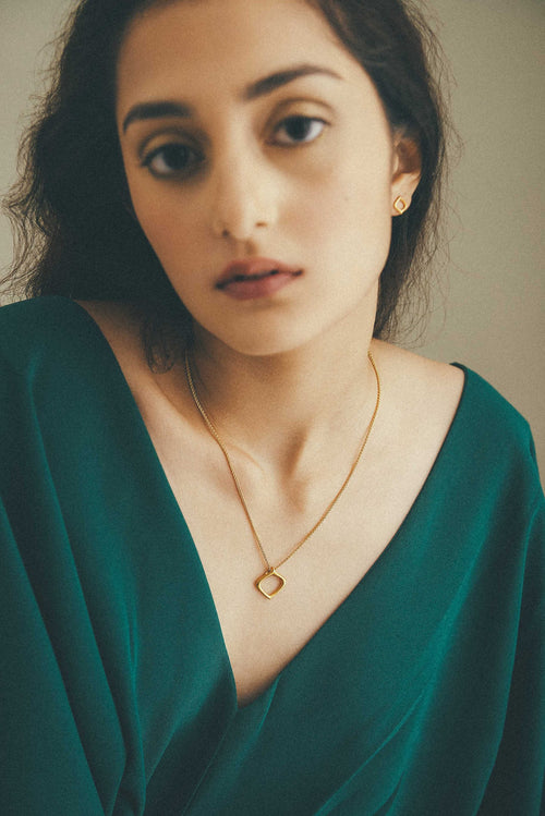 Moznabi Jewellery's Essence of Persia studs and pendant on a model.