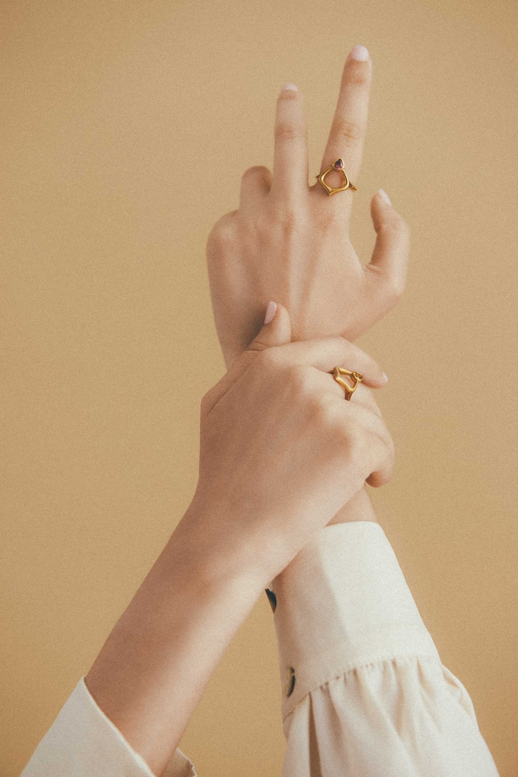 Model wearing Alborz rings handmade by Roxanna Moznabi