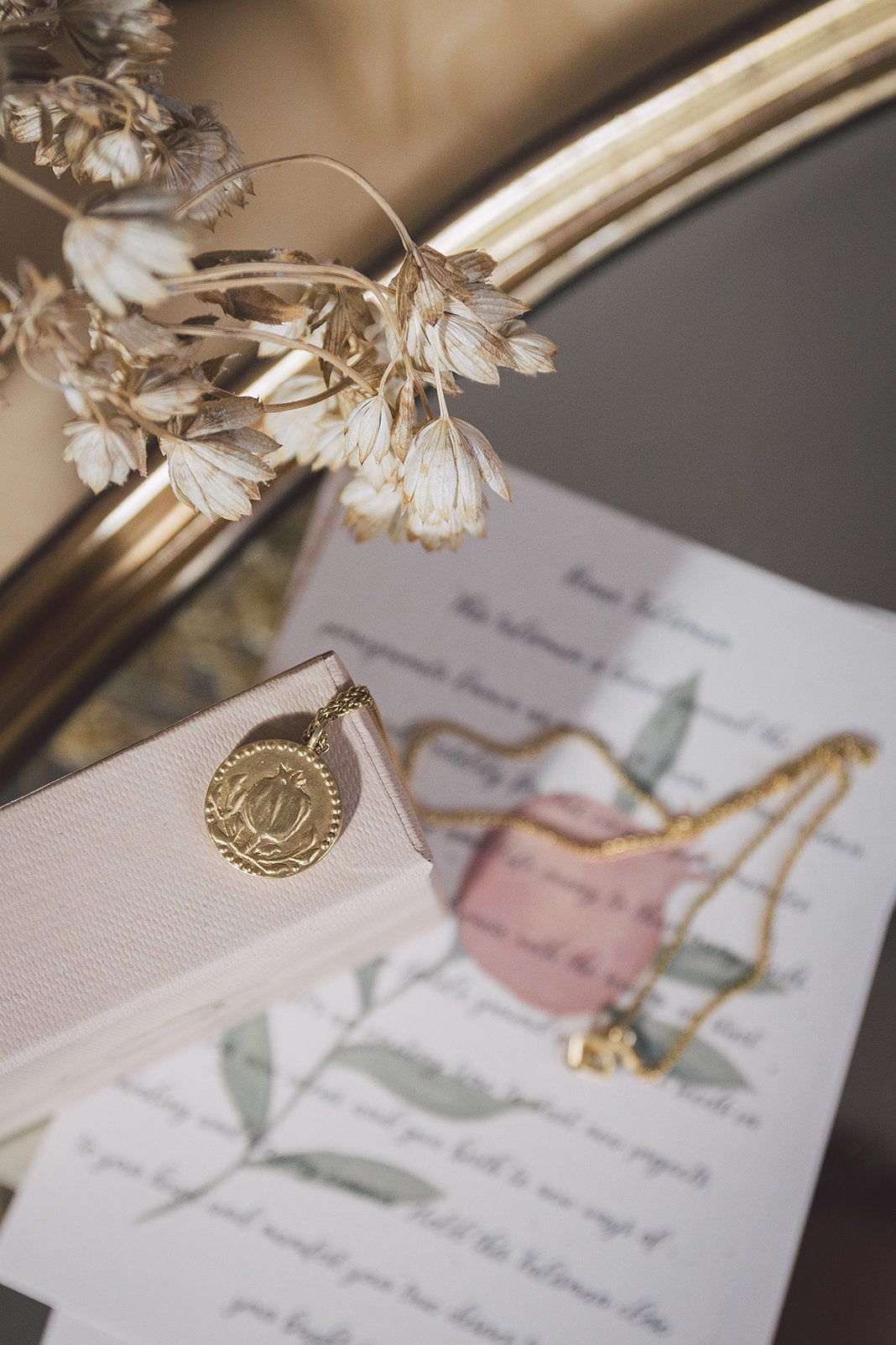 Closeup of the Anar Gold Pendant coin.